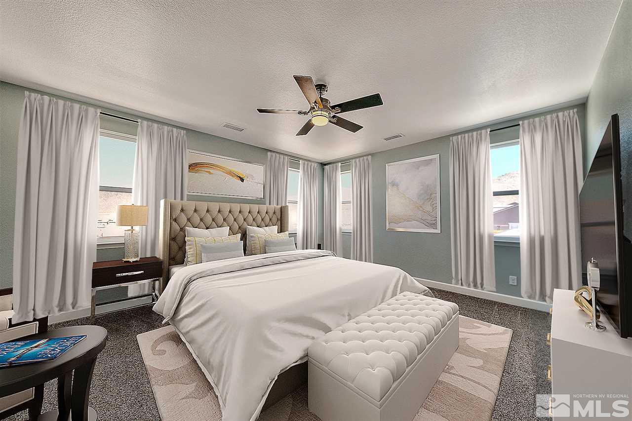 2985 Bull Rider Drive Reno, NV 89521 - Photo 7 of 16 a bedroom with a large bed and a chandelier