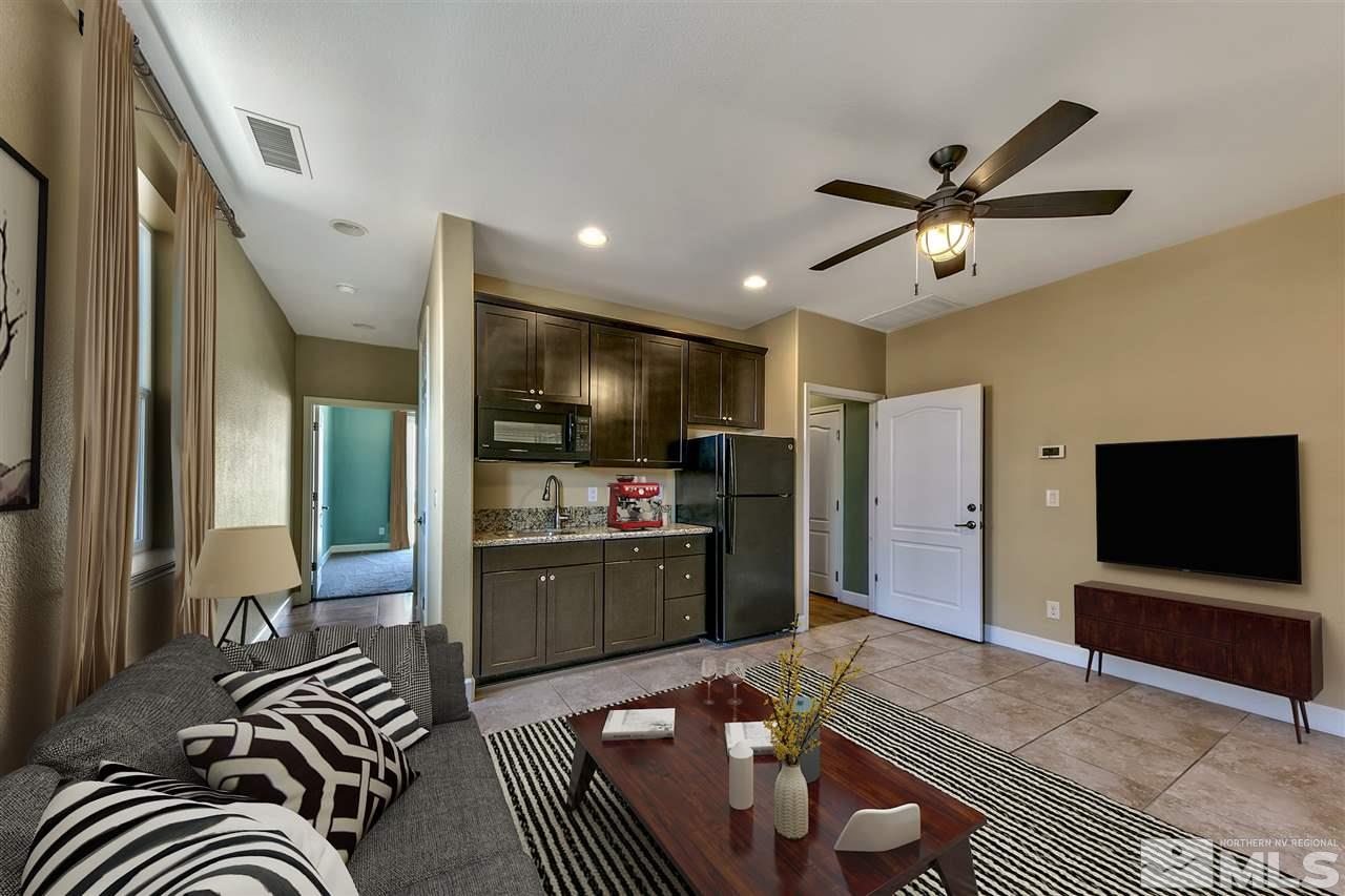 2985 Bull Rider Drive Reno, NV 89521 - Photo 10 of 16 a living room with furniture and a flat screen tv