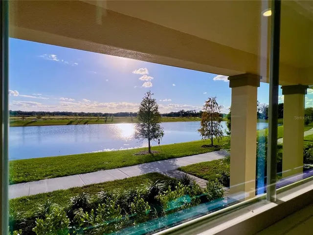 a view of a garden with a building in the background
