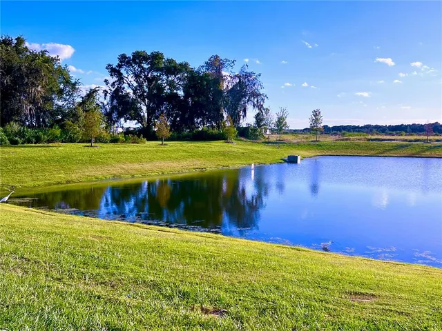a view of a swimming pool with an outdoor space and seating