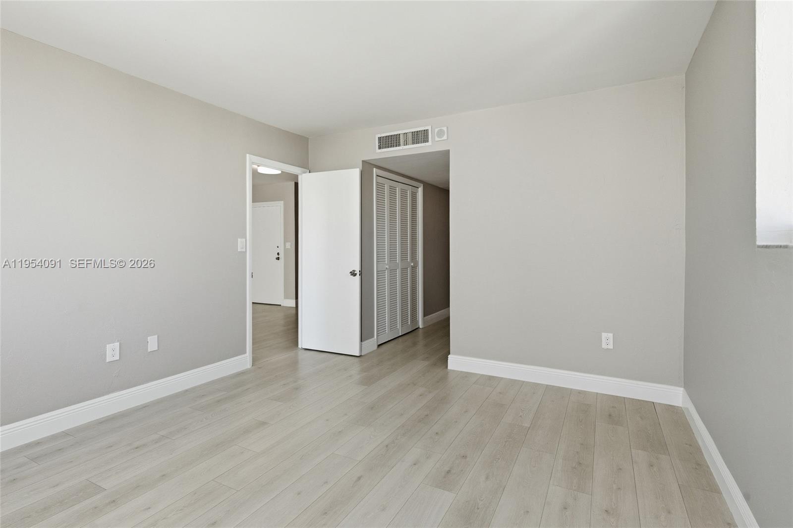 1345 Lincoln Road, Unit 1006 Miami Beach, FL 33139 - Photo 12 of 27 wooden floor in an empty room