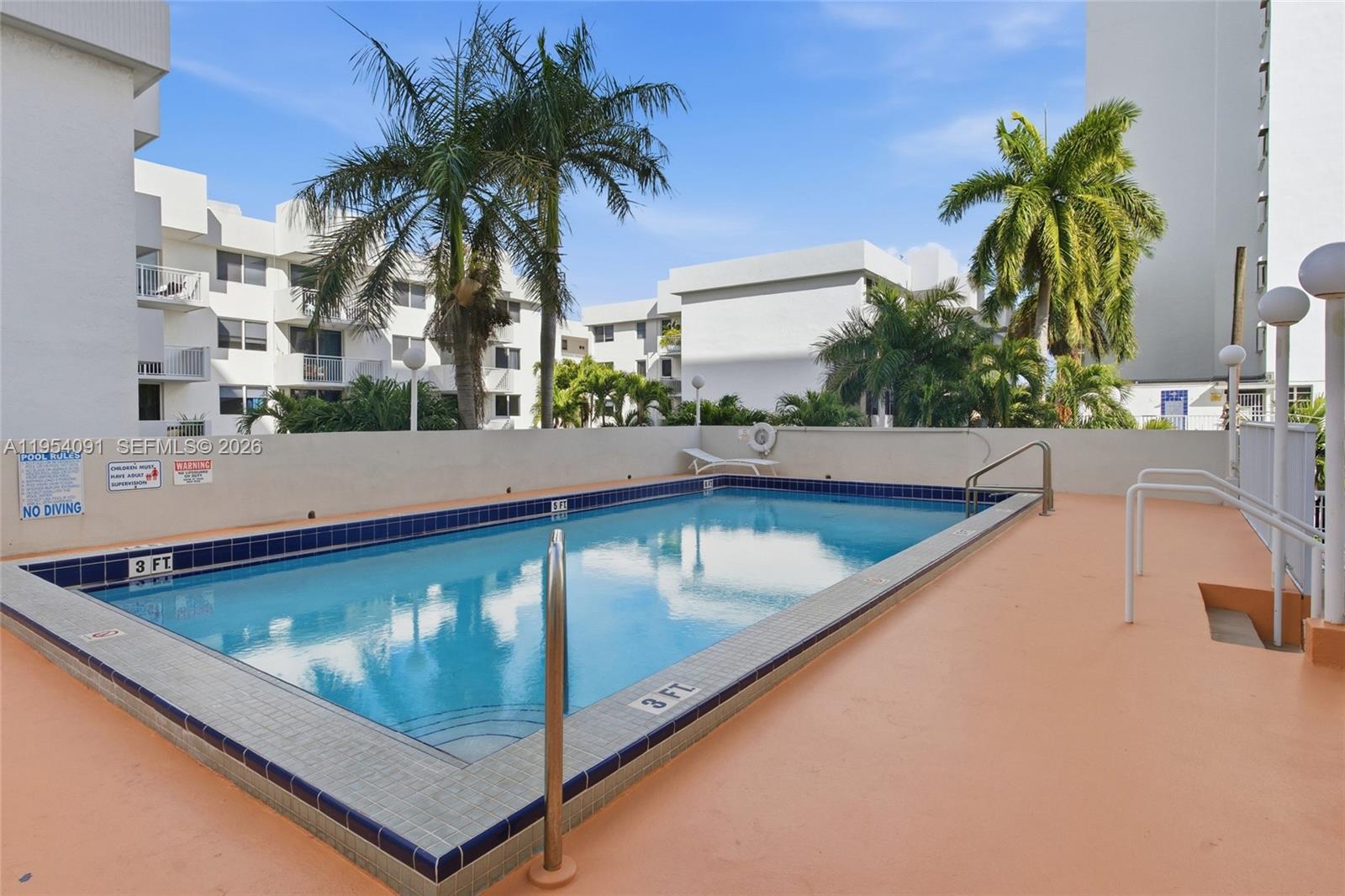 1345 Lincoln Road, Unit 1006 Miami Beach, FL 33139 - Photo 23 of 27 a view of swimming pool with a chair