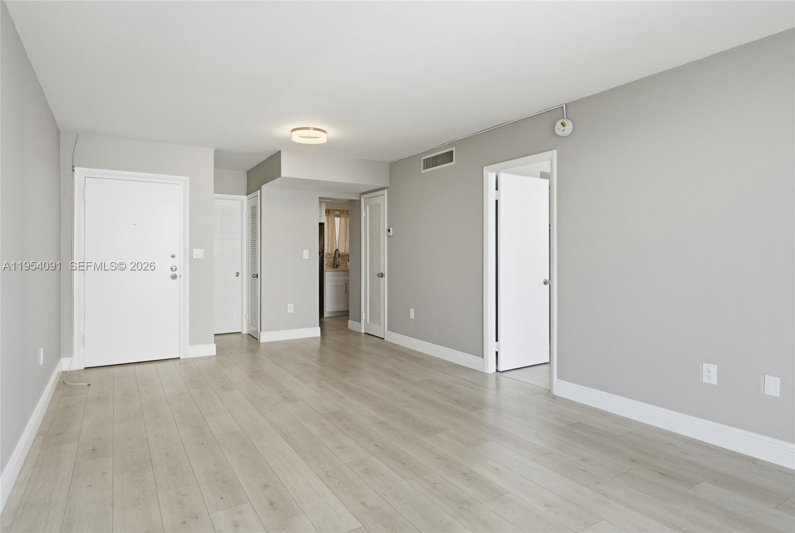 1345 Lincoln Road, Unit 1006 Miami Beach, FL 33139 - Photo 8 of 27 wooden floor in an empty room