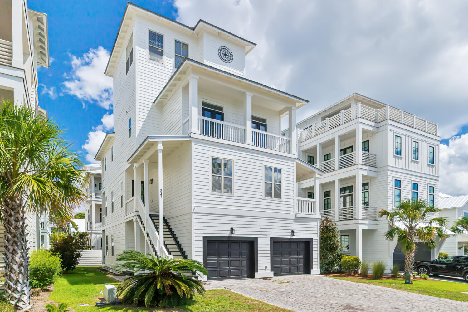 337 Grande Pointe Circle Inlet Beach, FL 32461 - Photo 4 of 73 a front view of a multi story residential apartment building with yard and potted plants