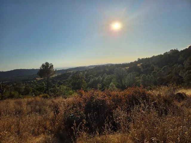 a view of mountain and field