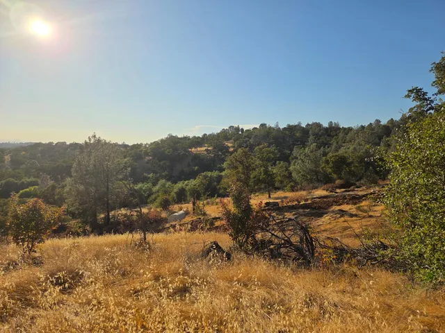 a view of a mountain view with mountains in the background