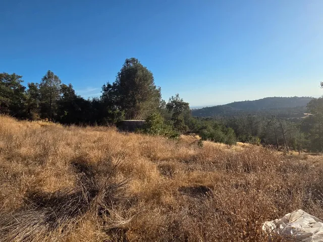 a view of mountain with lake view