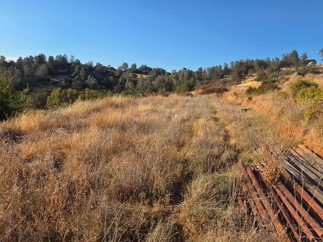 a view of a large mountain with a snow in the background