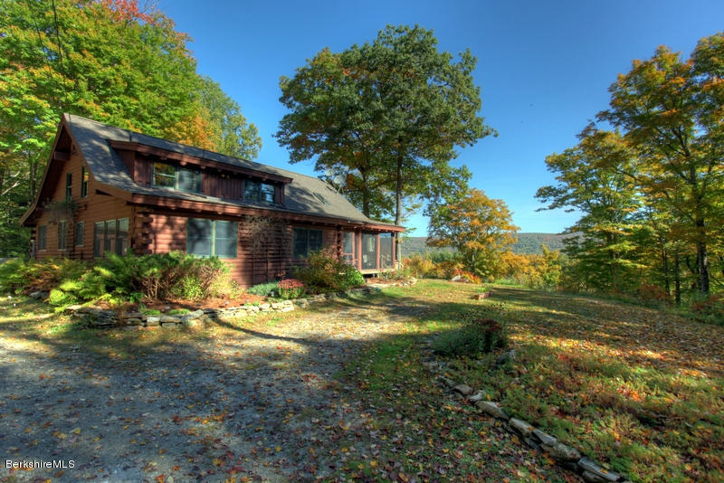 26 Mc Carthy Road Tyringham, MA 01264 - Photo 1 of 31 a view of a house with backyard and sitting area