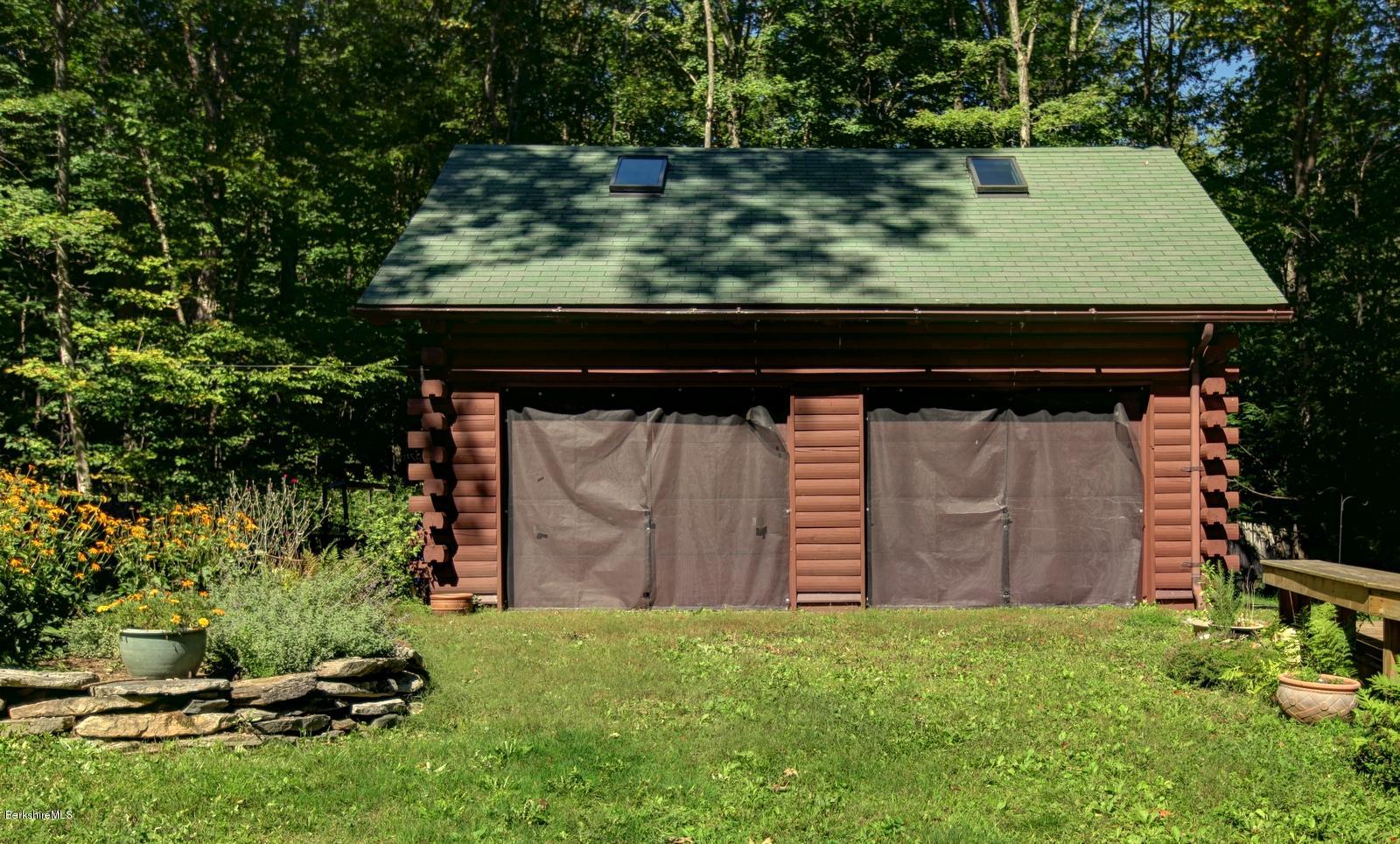 26 Mc Carthy Road Tyringham, MA 01264 - Photo 16 of 31 a backyard of a house with lots of green space