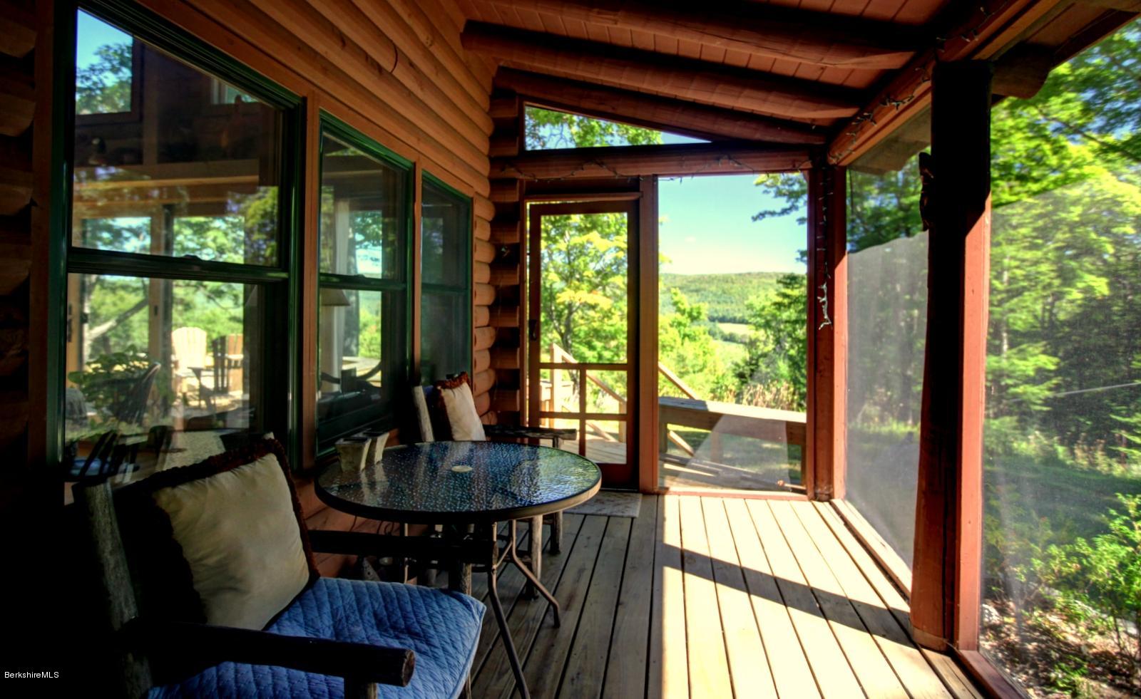 26 Mc Carthy Road Tyringham, MA 01264 - Photo 17 of 31 a view of a dining room with furniture window and outside view