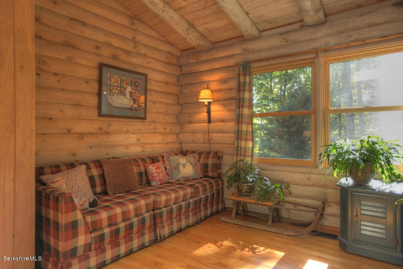 26 Mc Carthy Road Tyringham, MA 01264 - Photo 25 of 31 a living room with furniture and a potted plant