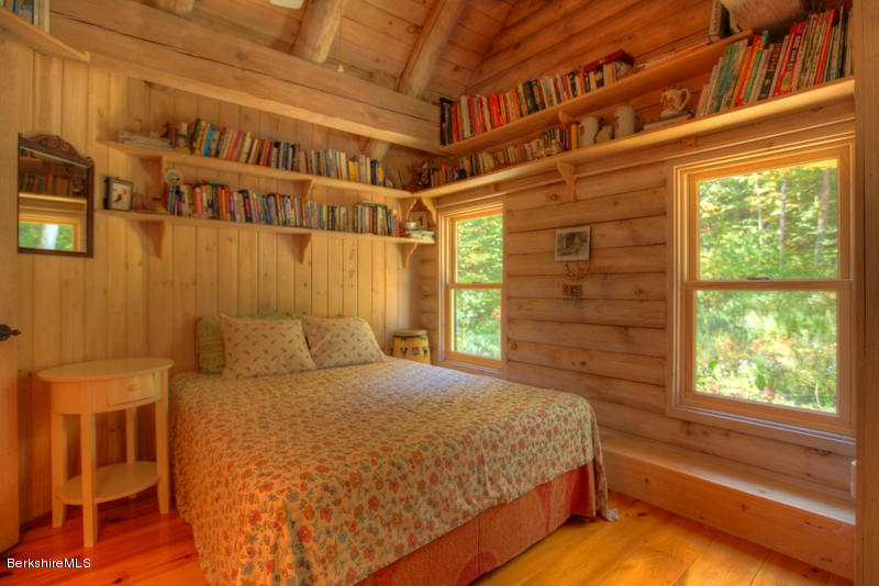 26 Mc Carthy Road Tyringham, MA 01264 - Photo 27 of 31 a bedroom with a bed and a window