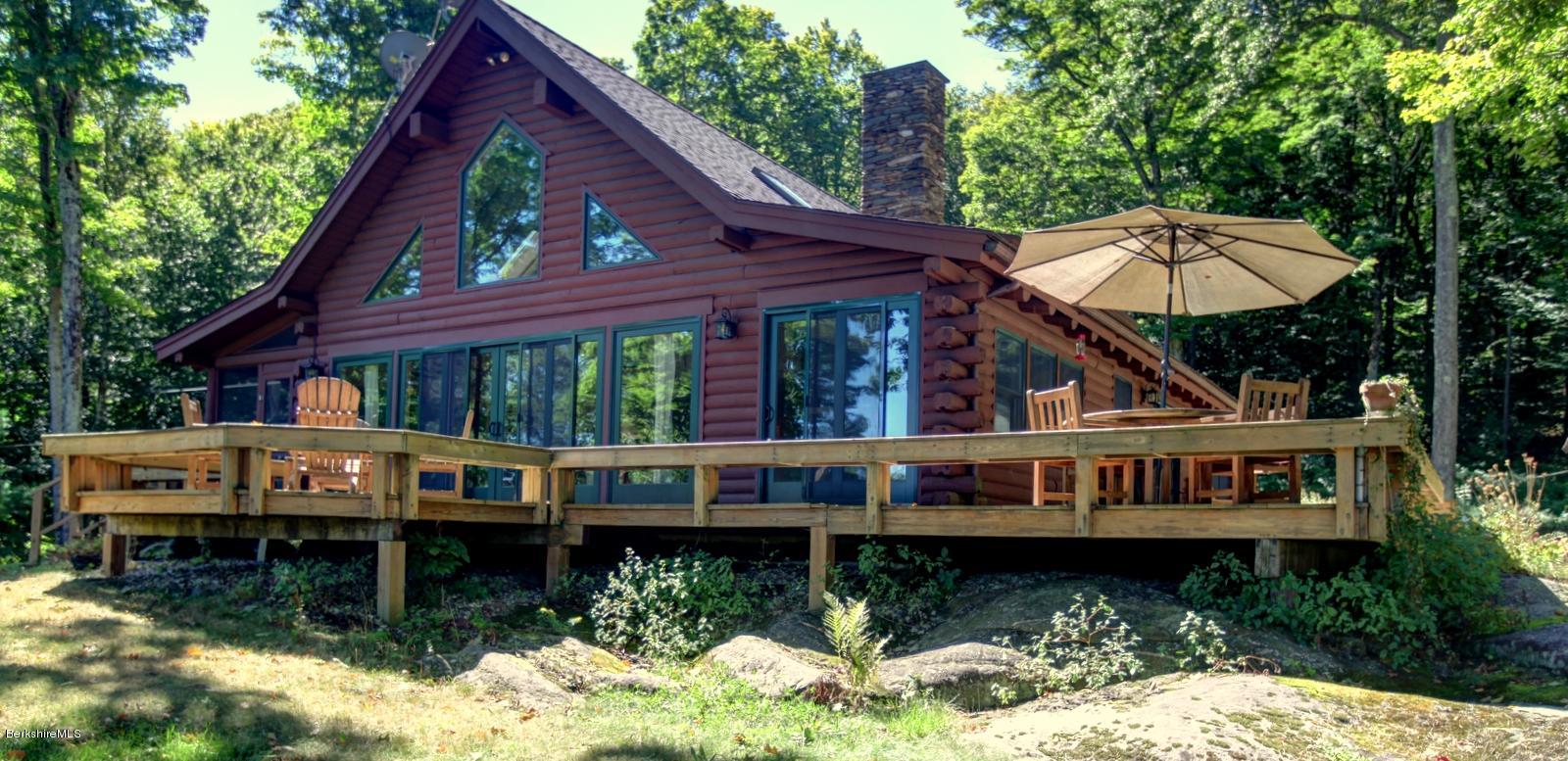 26 Mc Carthy Road Tyringham, MA 01264 - Photo 31 of 31 a view of a house with a yard balcony and furniture