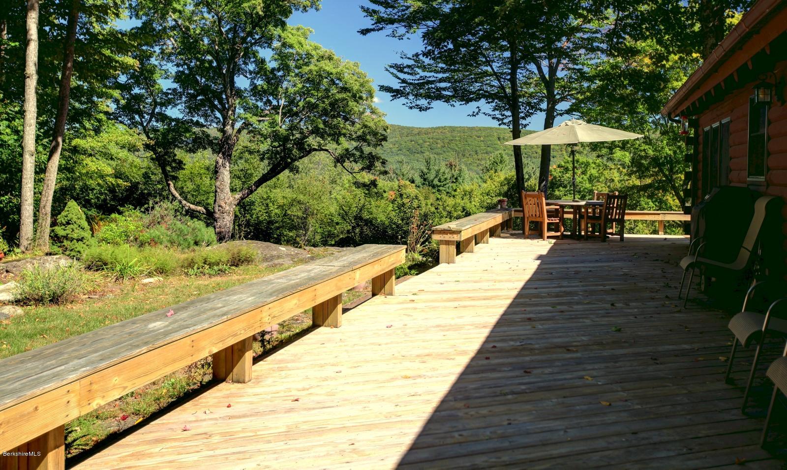 26 Mc Carthy Road Tyringham, MA 01264 - Photo 9 of 31 a swimming pool with outdoor seating and yard