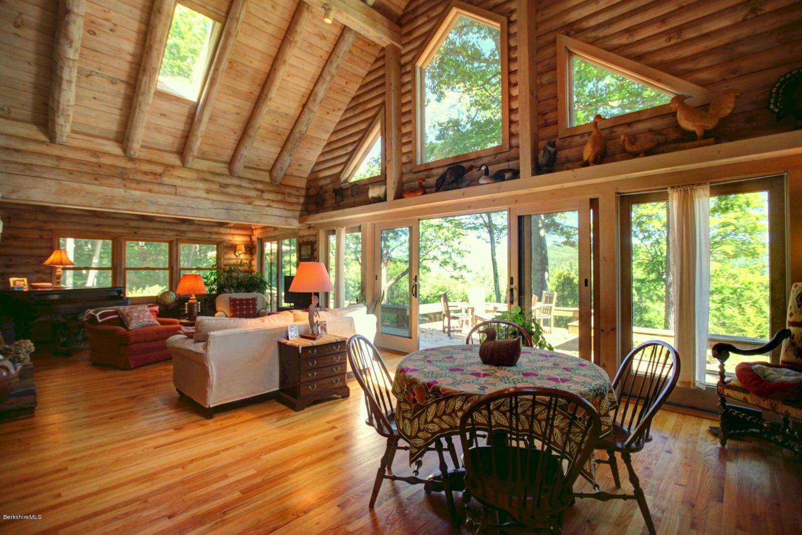 26 Mc Carthy Road Tyringham, MA 01264 - Photo 10 of 31 a dining room with furniture window wooden floor and garden view