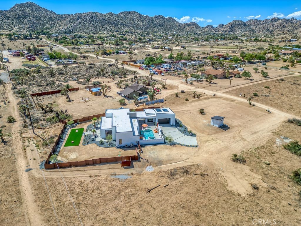 5165 Roy Rogers Road Pioneertown, CA 92268 - Photo 60 of 64 an aerial view of a swimming pool and mountain