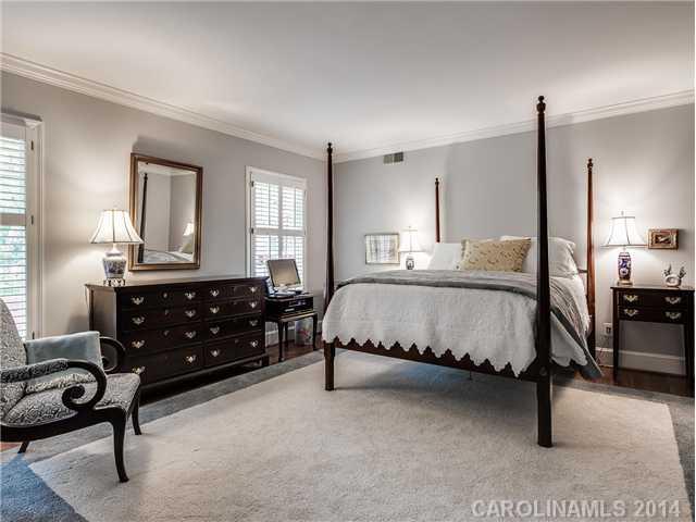 2935 Wheelock Road Charlotte, NC 28211 - Photo 9 of 16 a bedroom with a bed a table window and couch