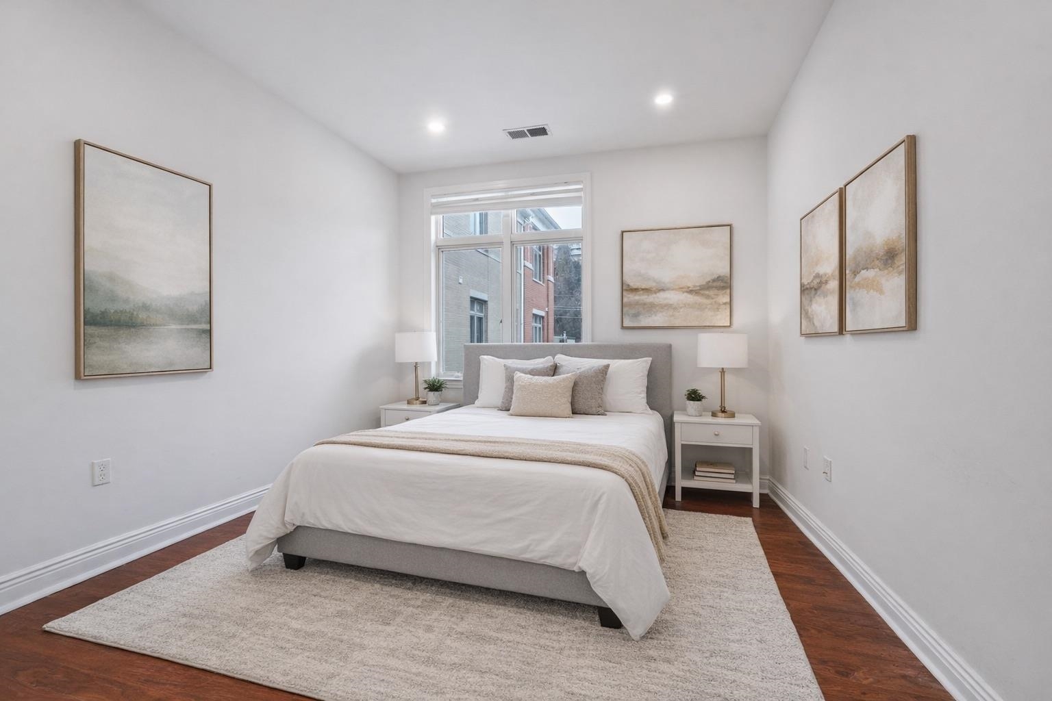 7400 River Road, Unit 317 North Bergen, NJ 07047 - Photo 21 of 41 a bedroom with a bed and a painting on the wall