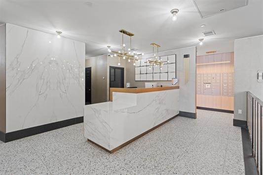 7400 River Road, Unit 317 North Bergen, NJ 07047 - Photo 26 of 41 a large room with chandelier and entryway