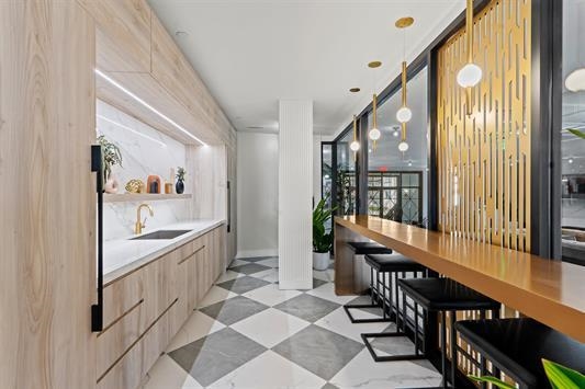 7400 River Road, Unit 317 North Bergen, NJ 07047 - Photo 31 of 41 a view of a hallway with wooden floor and windows