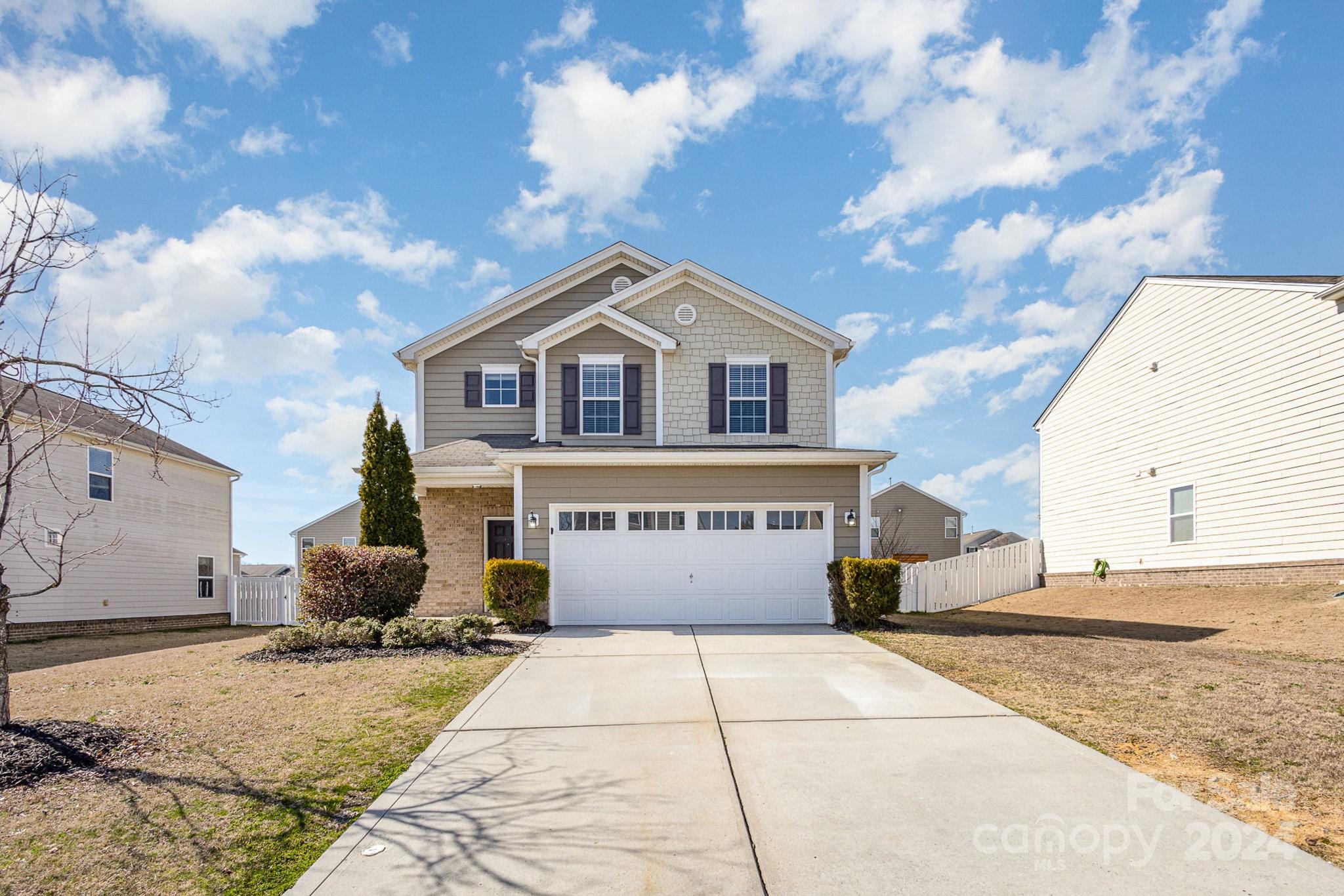 1005 Green Terra Road Indian Trail, NC 28079 - Photo 1 of 19 a front view of a house with a yard