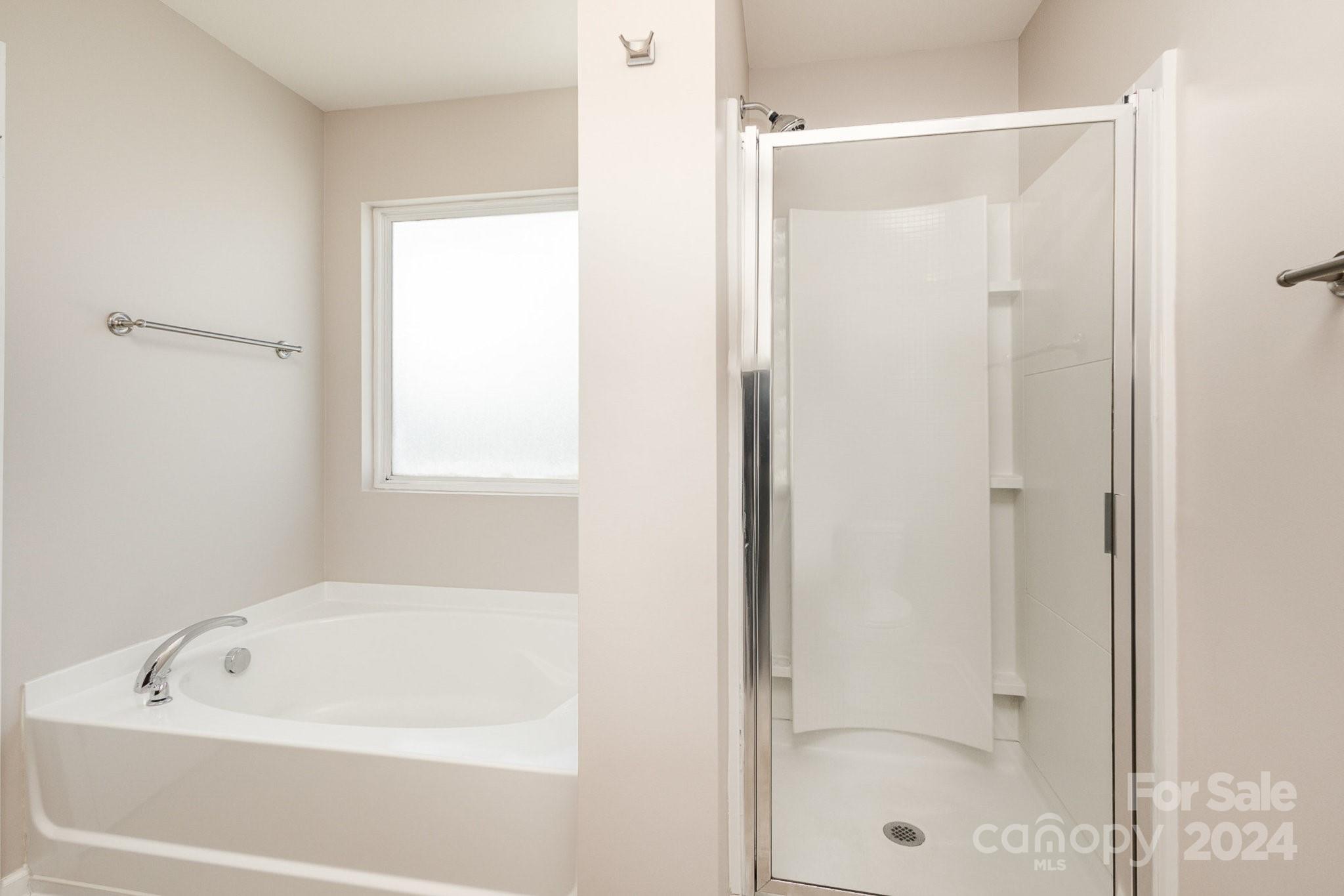 1005 Green Terra Road Indian Trail, NC 28079 - Photo 13 of 19 a bathroom with a bathtub and a shower