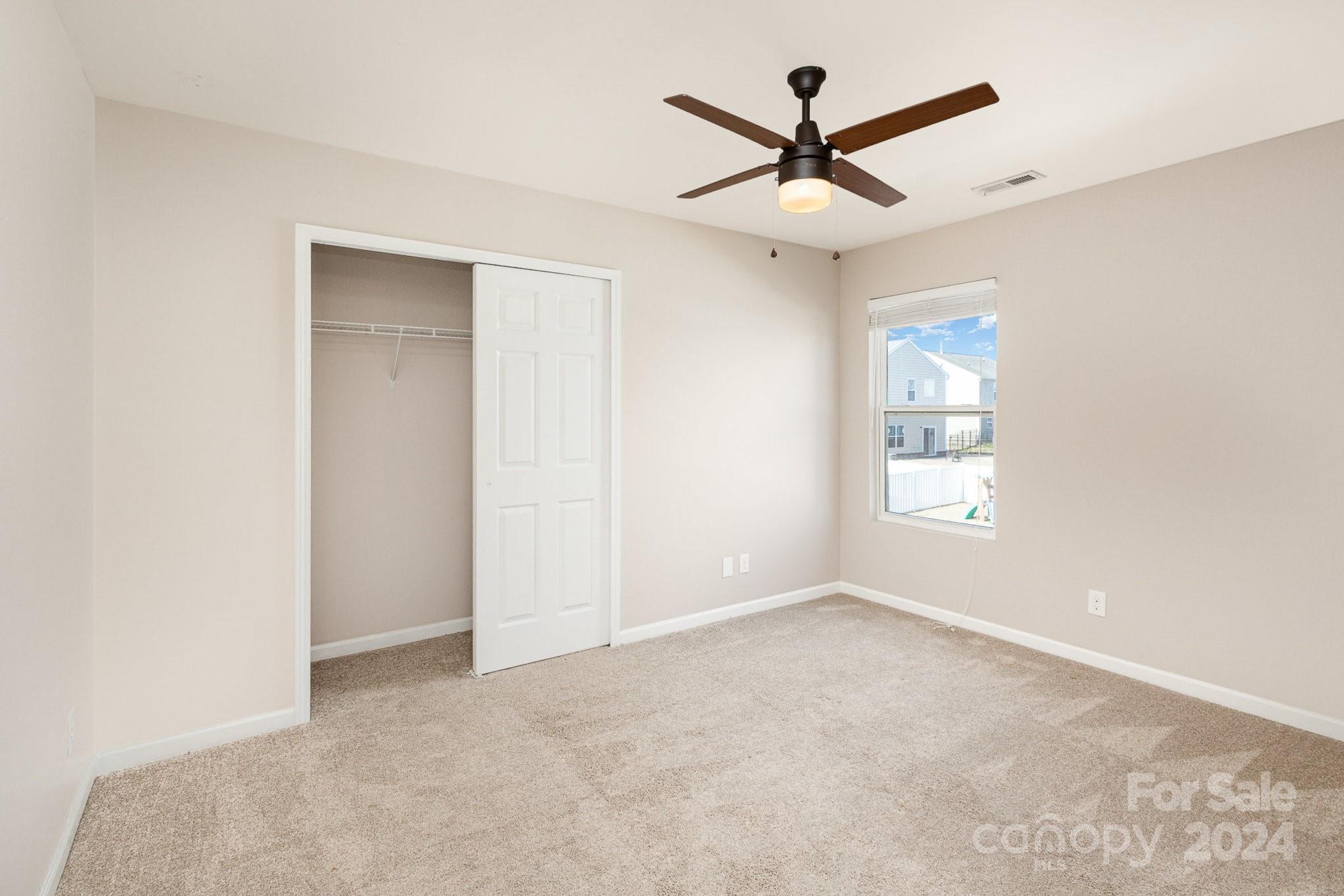 1005 Green Terra Road Indian Trail, NC 28079 - Photo 14 of 19 a view of a livingroom with a ceiling fan and window