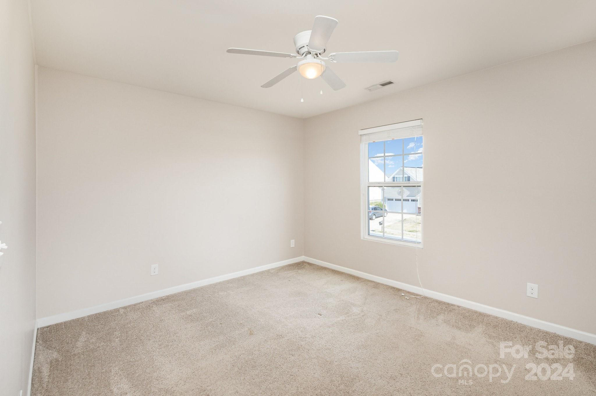 1005 Green Terra Road Indian Trail, NC 28079 - Photo 15 of 19 an empty room with windows and fan