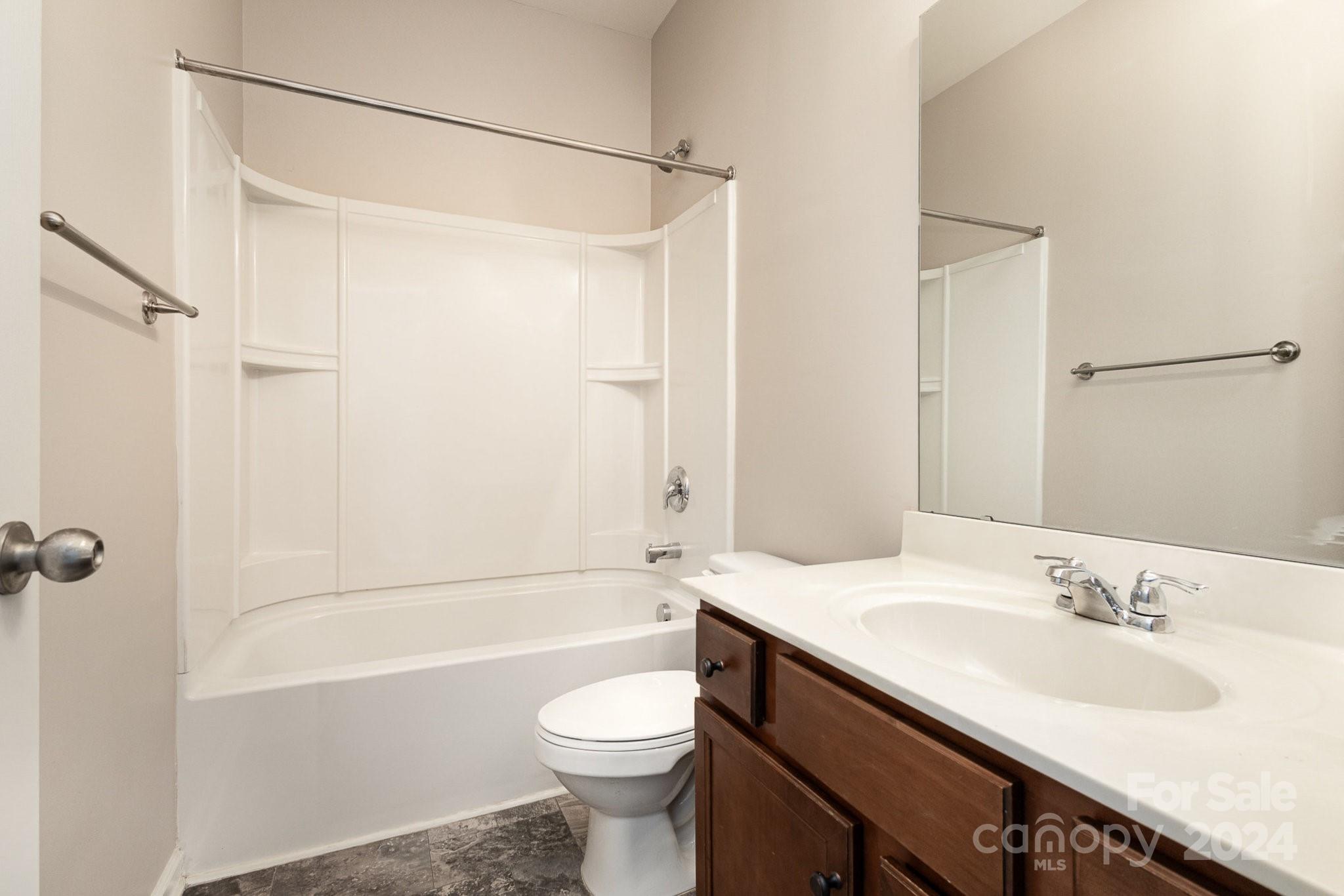 1005 Green Terra Road Indian Trail, NC 28079 - Photo 17 of 19 a bathroom with a sink a toilet and shower