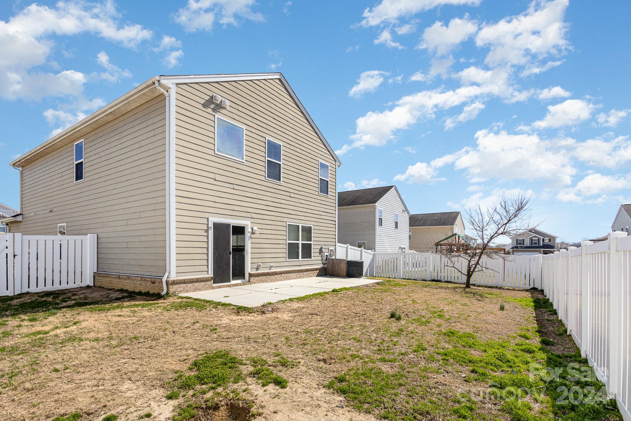 1005 Green Terra Road Indian Trail, NC 28079 - Photo 18 of 19 a house view with a backyard space