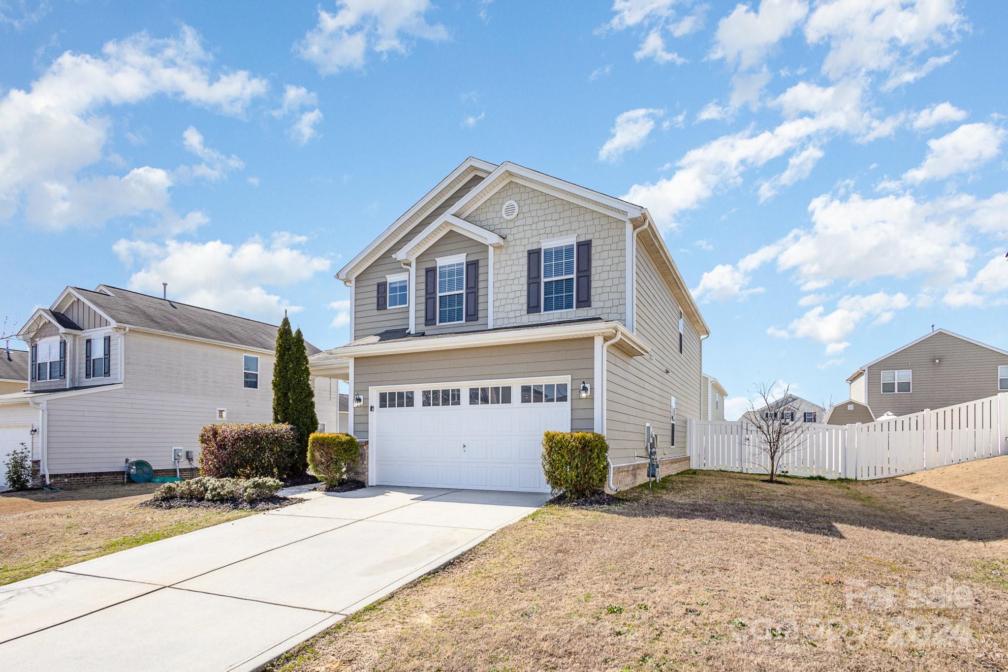 1005 Green Terra Road Indian Trail, NC 28079 - Photo 2 of 19 a front view of a house with a yard