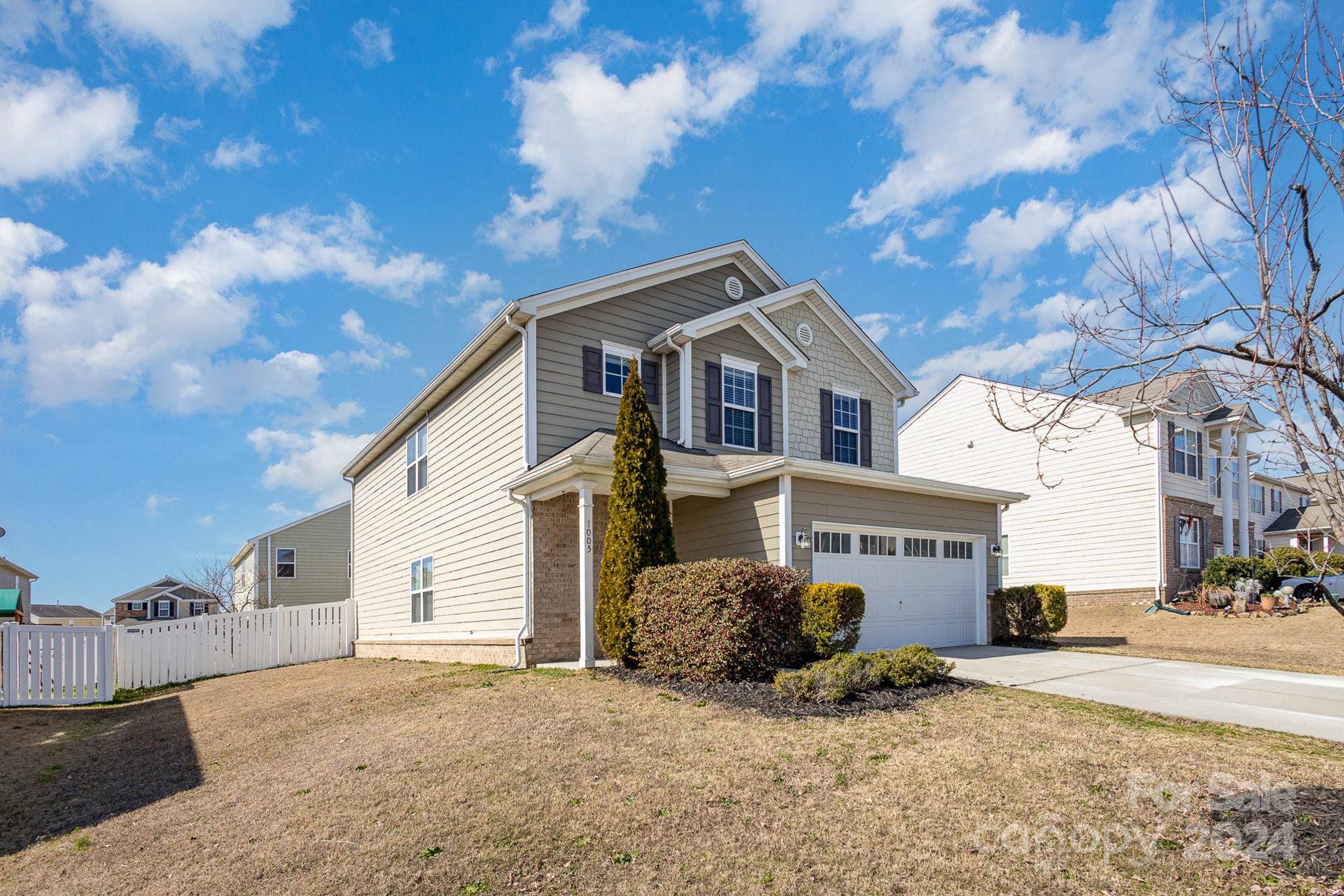 1005 Green Terra Road Indian Trail, NC 28079 - Photo 3 of 19 a front view of a house with a yard