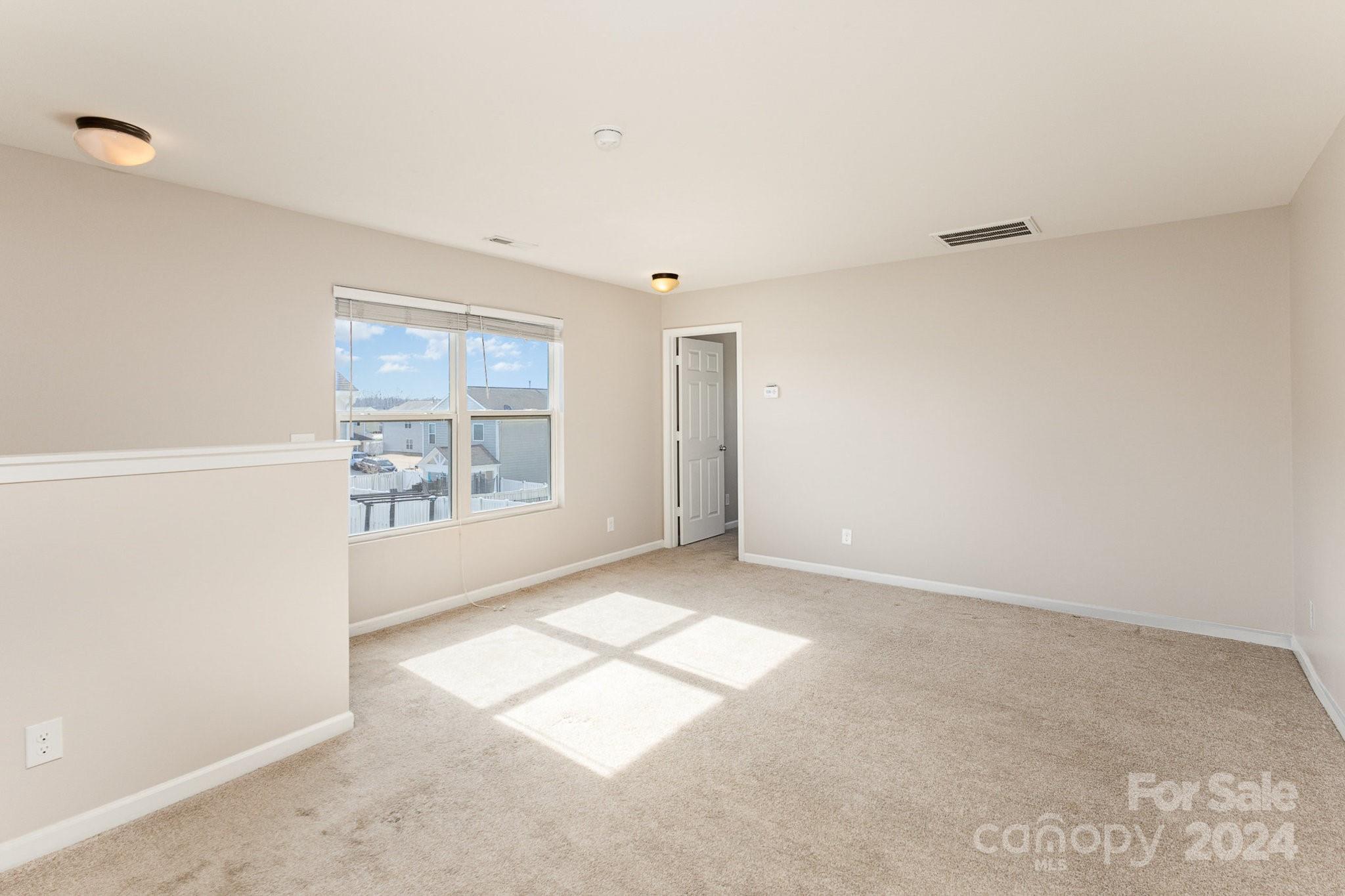 1005 Green Terra Road Indian Trail, NC 28079 - Photo 10 of 19 an empty room with windows
