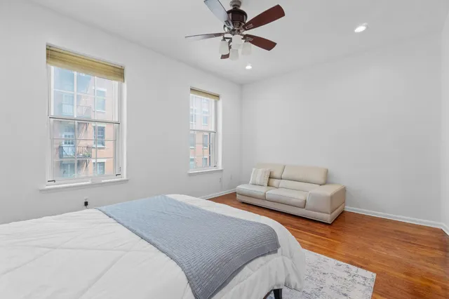 a bedroom with furniture and a window
