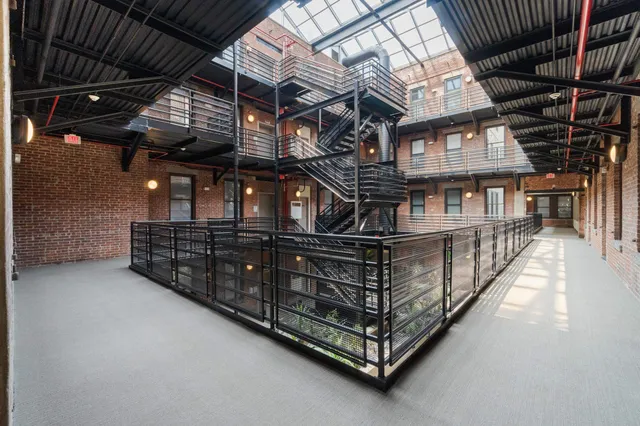 a kitchen with lots of counter top space and stainless steel appliances