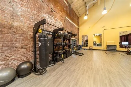 a view of a room with wooden floor