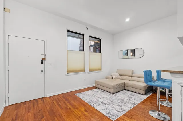 a living room with furniture and a rug