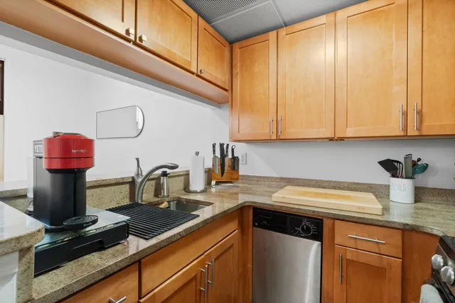 a kitchen with a sink cabinets and appliances