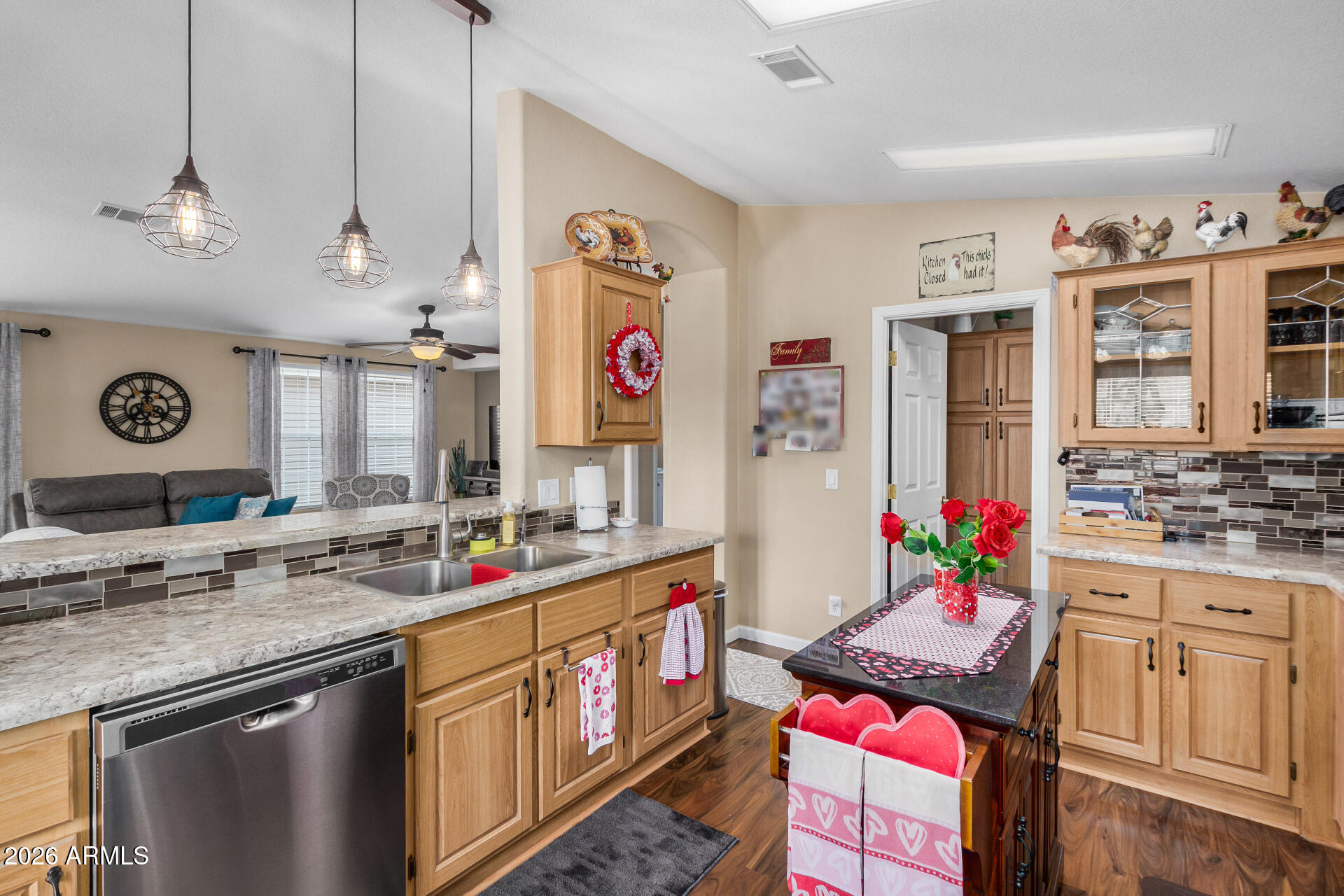 3301 South Goldfield Road, Unit 1006 Apache Junction, AZ 85119 - Photo 12 of 30 a kitchen with stainless steel appliances granite countertop a sink stove and refrigerator