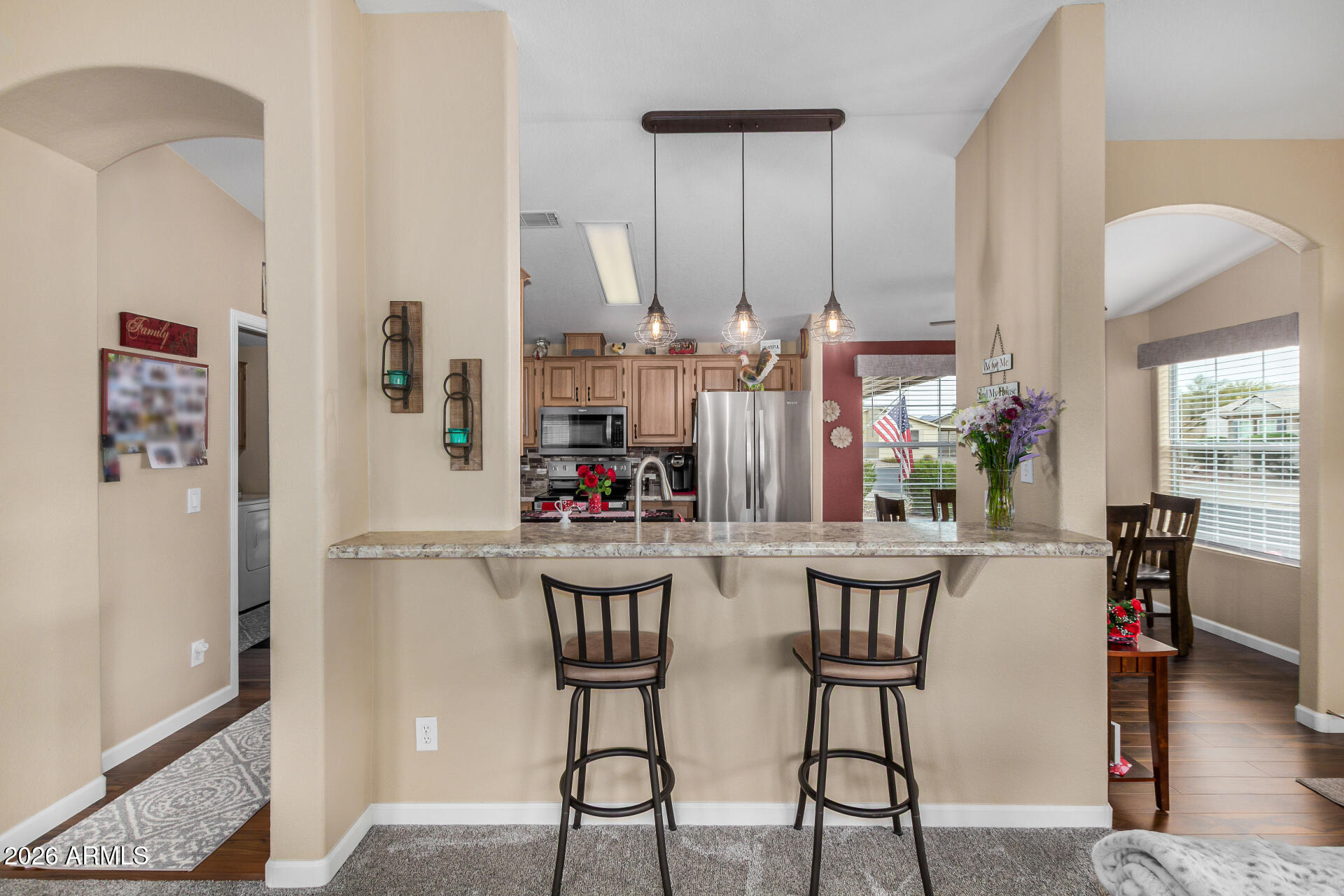 3301 South Goldfield Road, Unit 1006 Apache Junction, AZ 85119 - Photo 13 of 30 a dining room with furniture and wooden floor