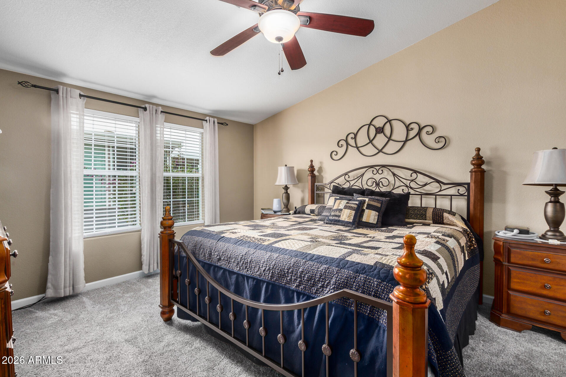 3301 South Goldfield Road, Unit 1006 Apache Junction, AZ 85119 - Photo 14 of 30 a bed sitting in a bedroom next to a window