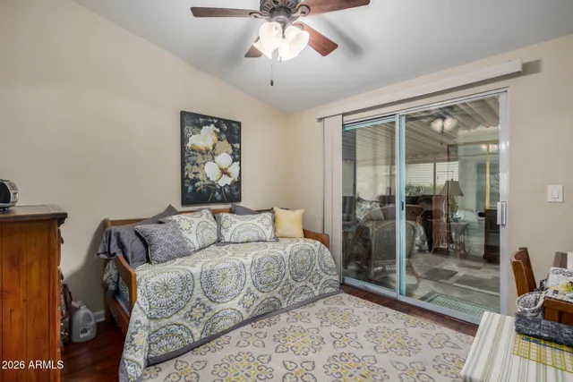 a living room with a couch and a chandelier