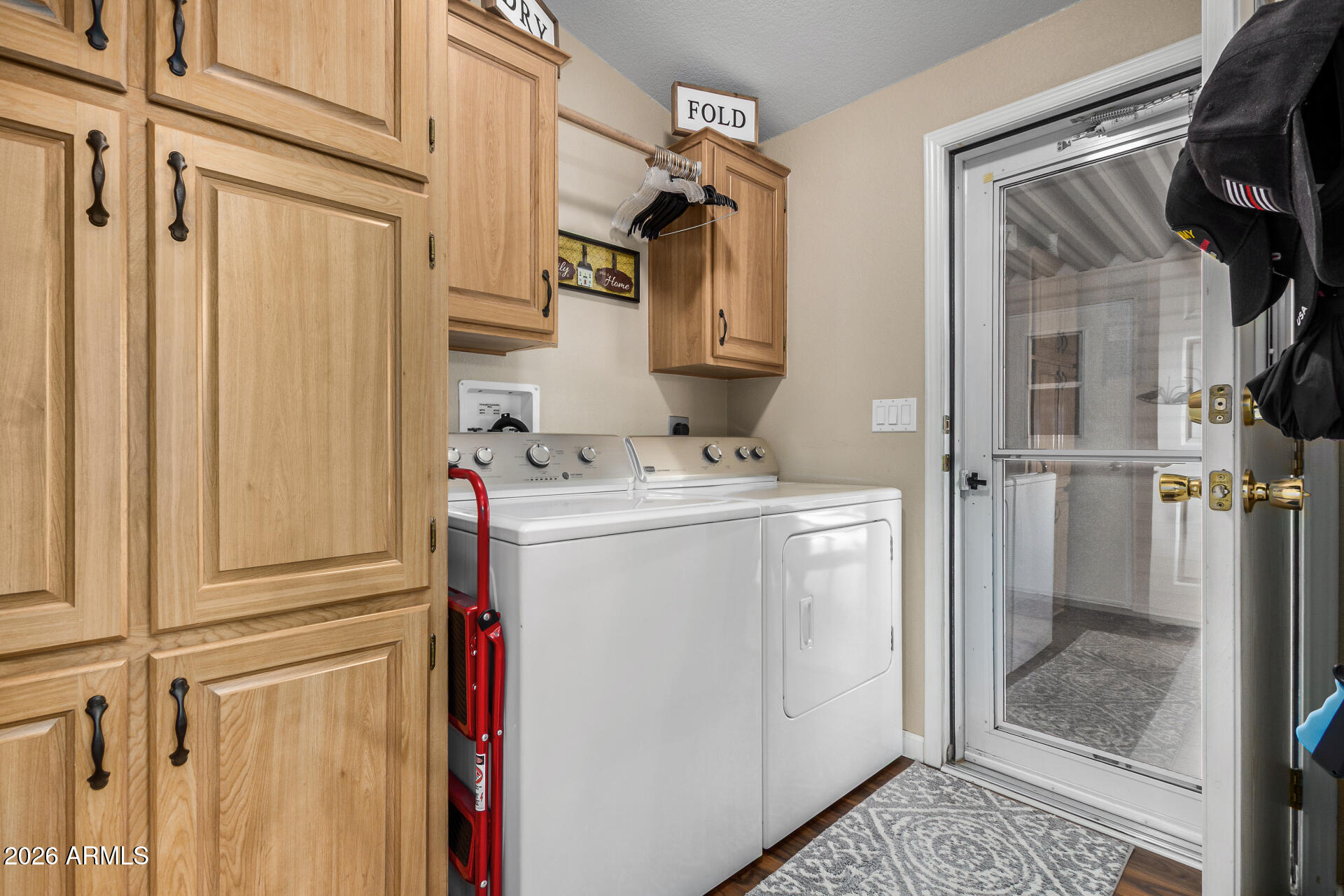 3301 South Goldfield Road, Unit 1006 Apache Junction, AZ 85119 - Photo 22 of 30 a utility room with dryer and washer