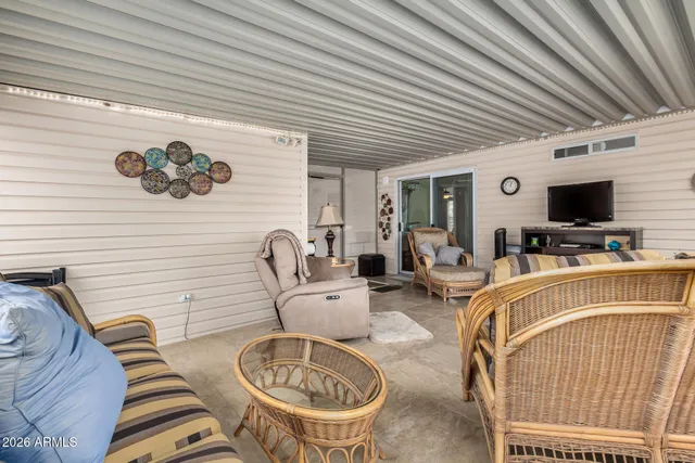 a view of a livingroom with furniture and a flat screen tv