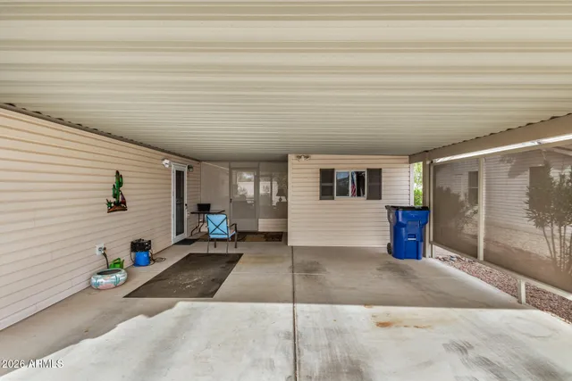 a lobby with furniture and floor to ceiling window