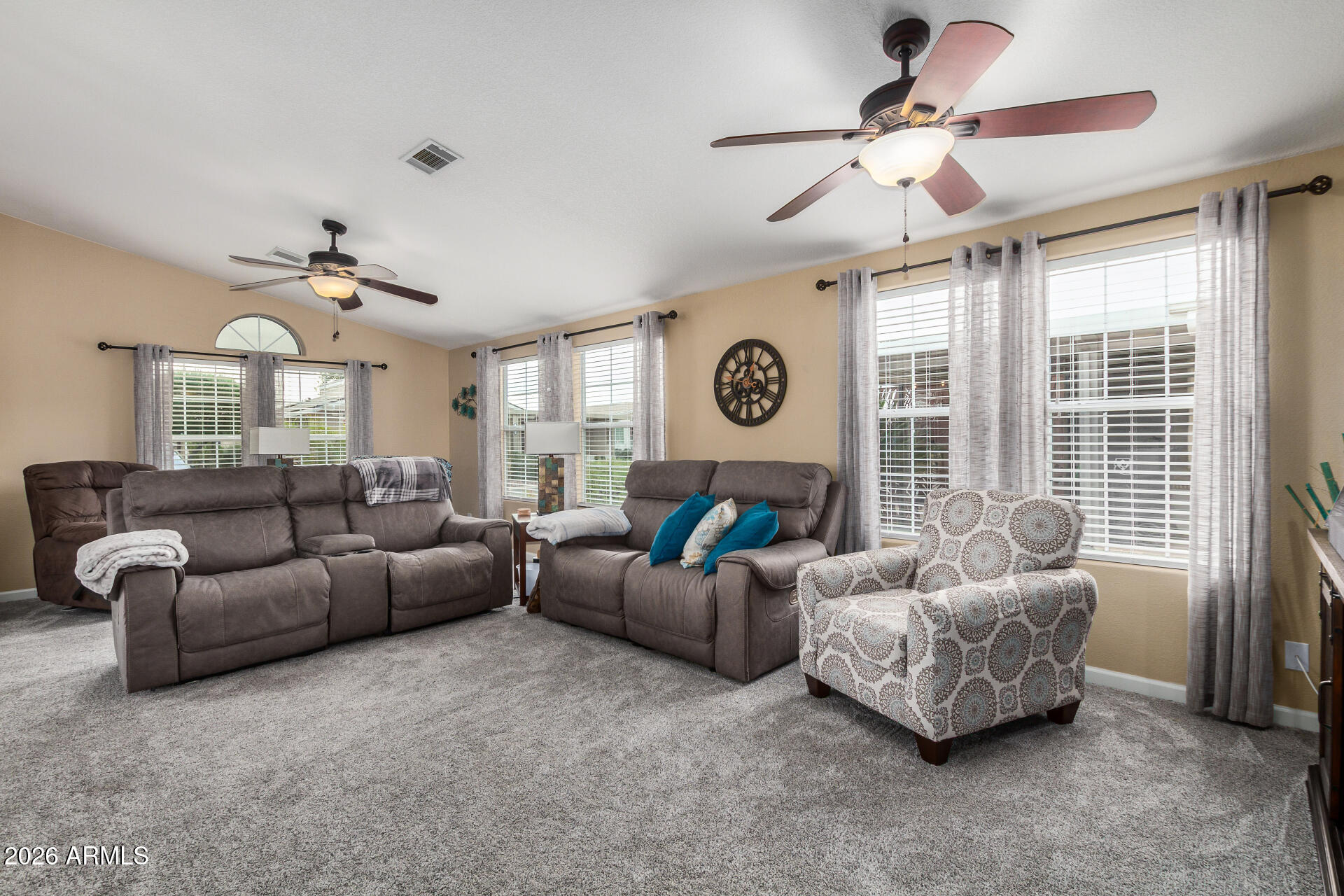 3301 South Goldfield Road, Unit 1006 Apache Junction, AZ 85119 - Photo 7 of 30 a living room with furniture and a large window
