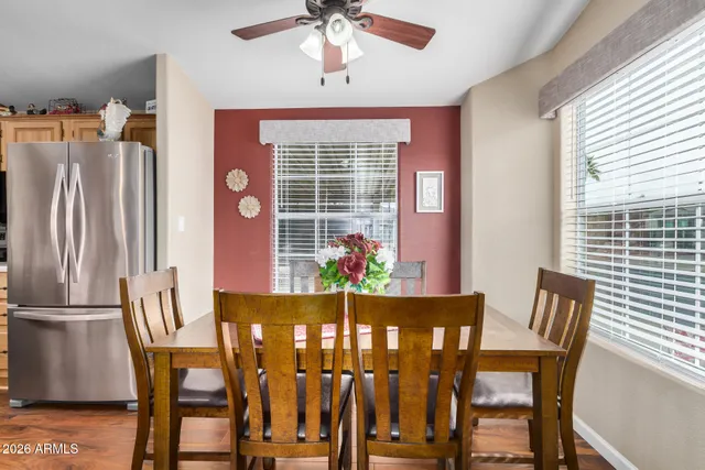 a view of a dining room with furniture window and wooden floor