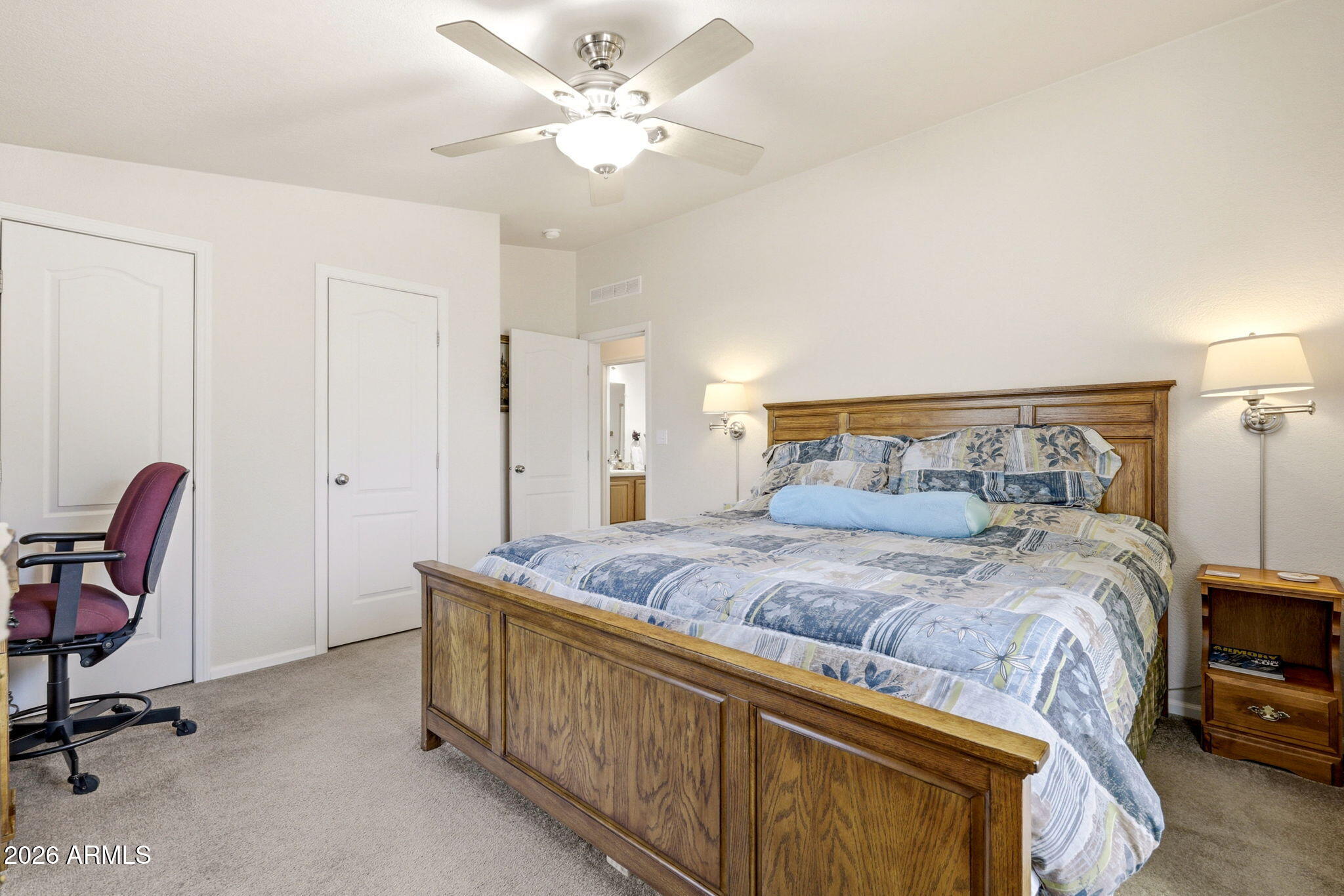 6 County Road Concho, AZ 85924 - Photo 19 of 39 a bedroom with a bed a chair and a chandelier