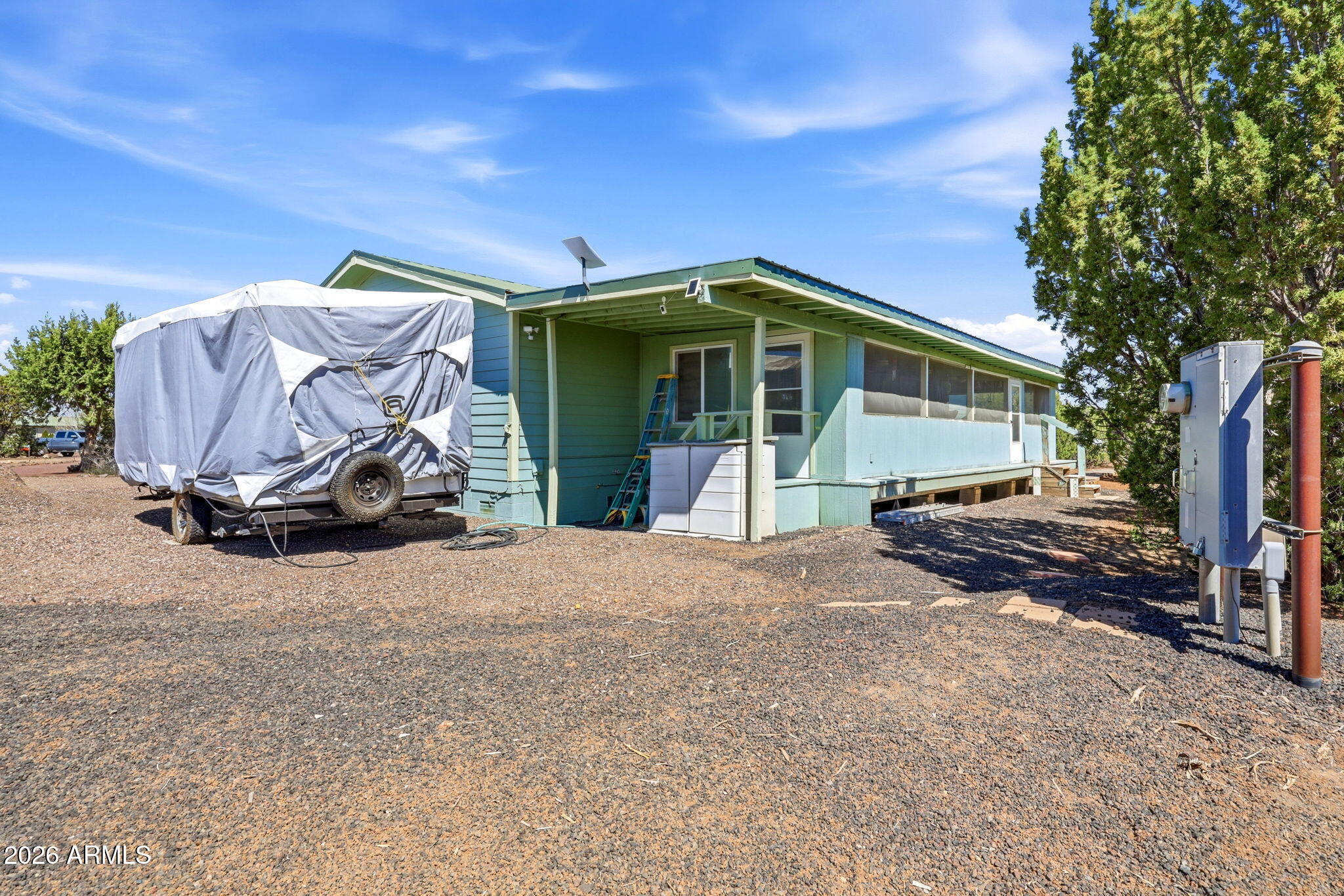 6 County Road Concho, AZ 85924 - Photo 29 of 39 a view of a house with a yard and garage